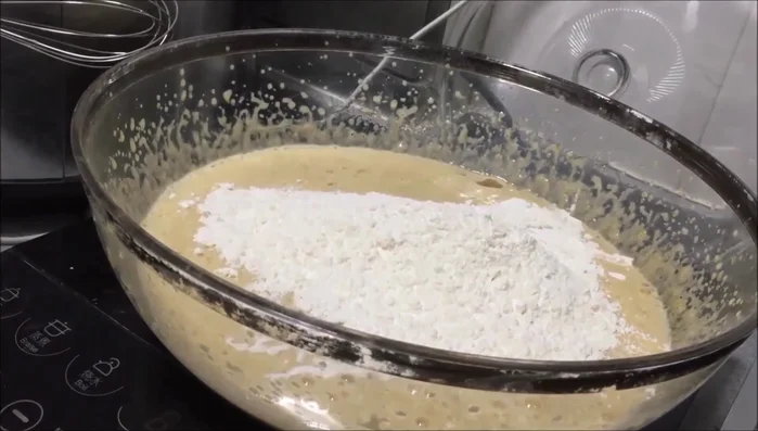Sift flour (optional) and incorporate it into the wet ingredients until smooth.