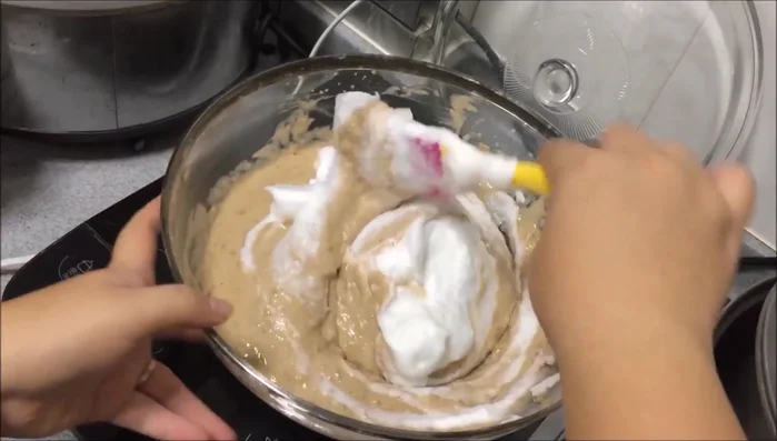 Gently fold the egg whites into the batter in three additions.