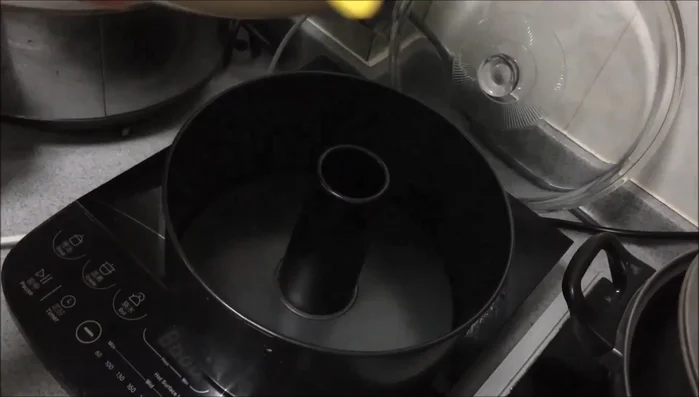 Transfer the batter to the prepared chiffon pan and spread evenly.