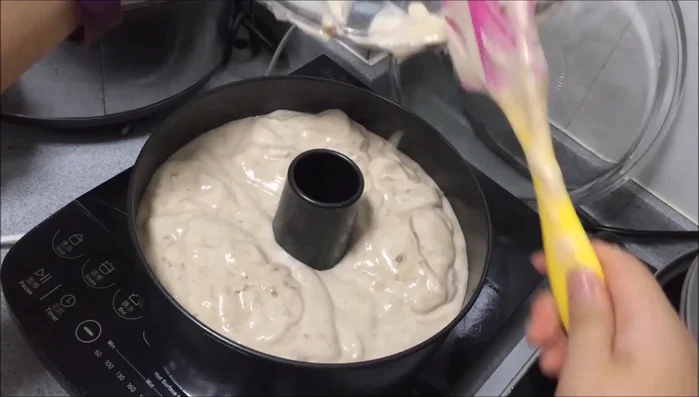 Jiggle the pan to remove air bubbles before baking at 325°F (160°C) for about an hour.