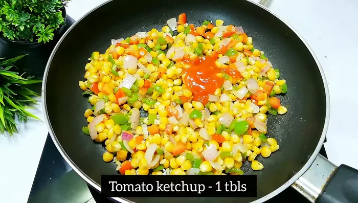 Add 1 tablespoon of tomato ketchup and mix well.