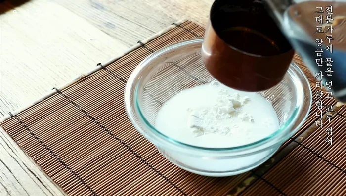 Prepare a batter by mixing starch powder and water. Let it settle.