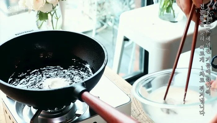 Preheat oil to 180 degrees. Coat the eggplant and mushrooms in batter and fry them quickly for the first time.
