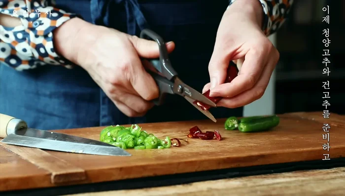 Prepare the chili peppers, garlic, and green onions.