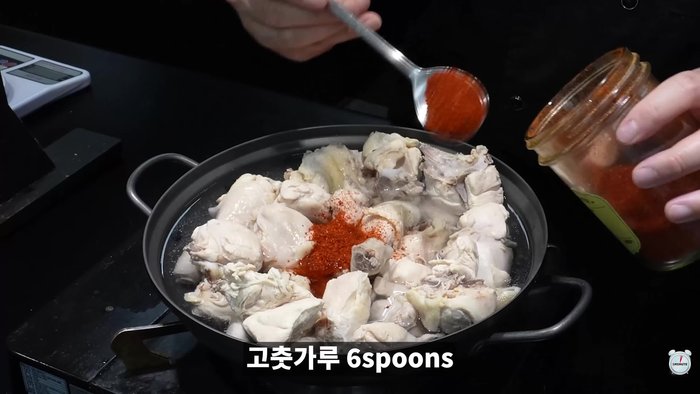 Add red pepper powder and anchovy sauce. Season with soy sauce, cooking wine, chicken stock, MSG, and pepper.