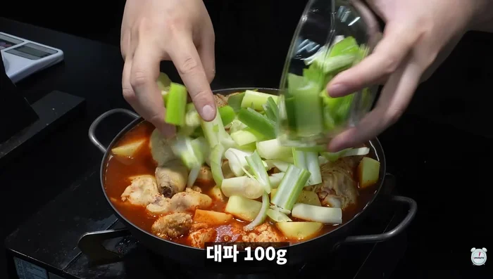 Add potatoes, onions, green onions, and green chili peppers. Boil vigorously for 10 minutes.