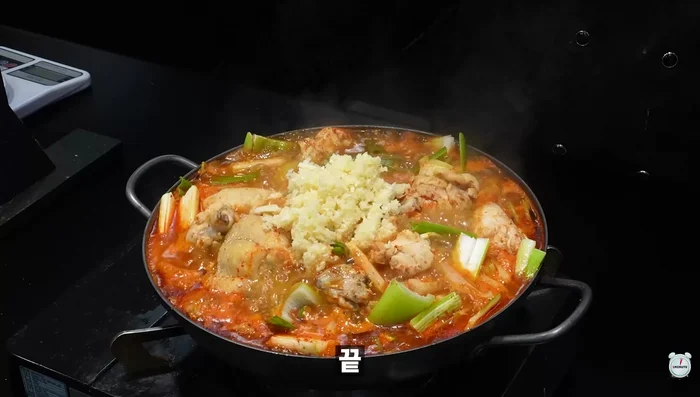 Add a generous amount of minced garlic and boil for another 5 minutes.
