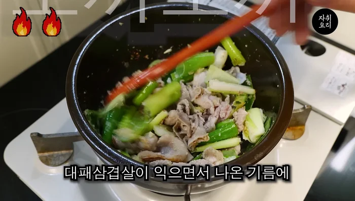 Add one spoonful of garlic and stir-fry everything together.