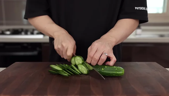 Slice cucumber into thin strips. Peel if skin is tough.