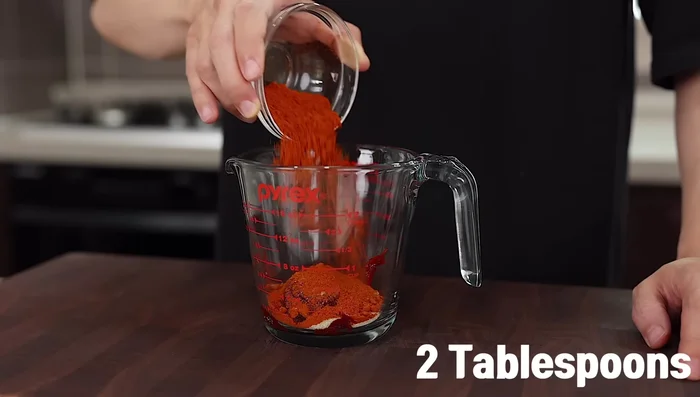 Prepare the sauce: Combine gochujang, sugar, gochugaru, corn syrup, soy sauce, vinegar, minced garlic, MSG (optional), and pineapple juice/Korean pear juice in a container.