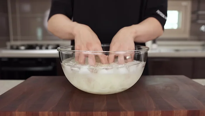 Drain noodles and rinse thoroughly in cold water to remove starch.
