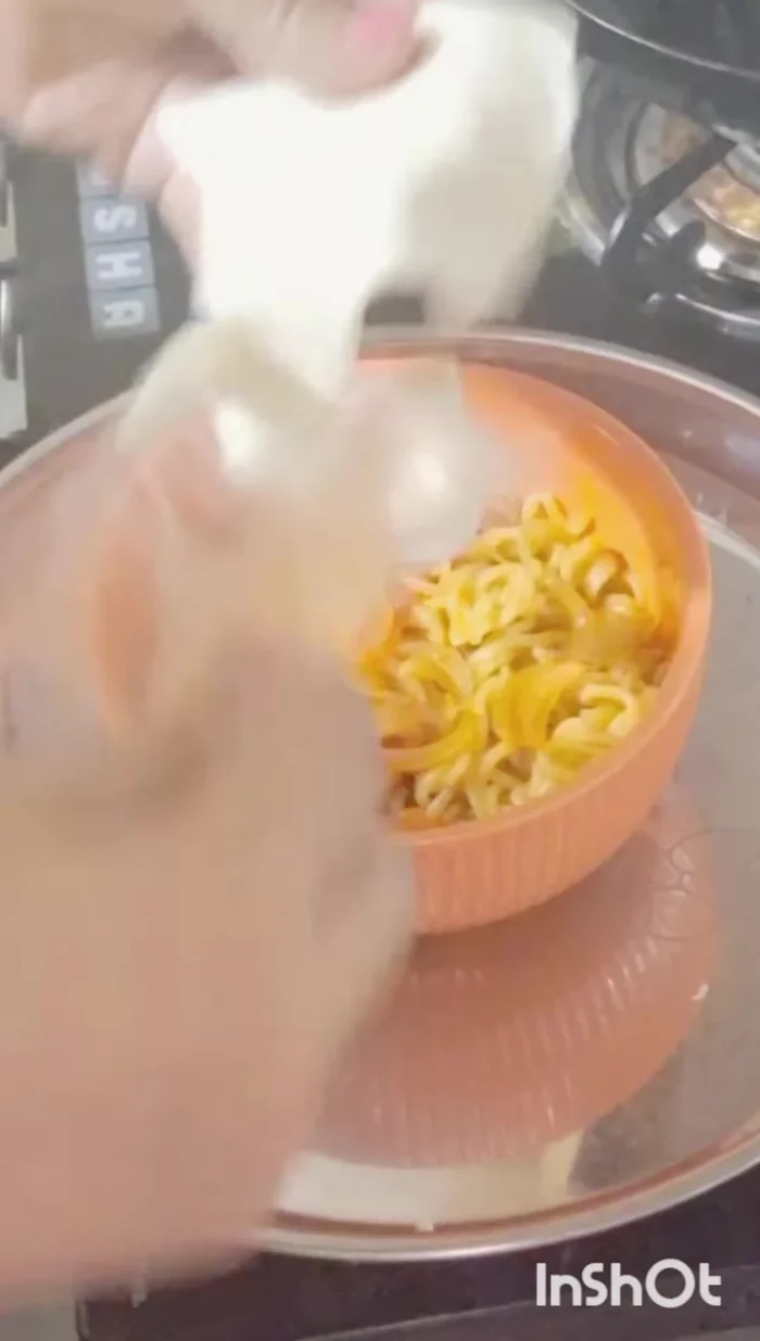 Top with sliced cheese and boiled eggs.