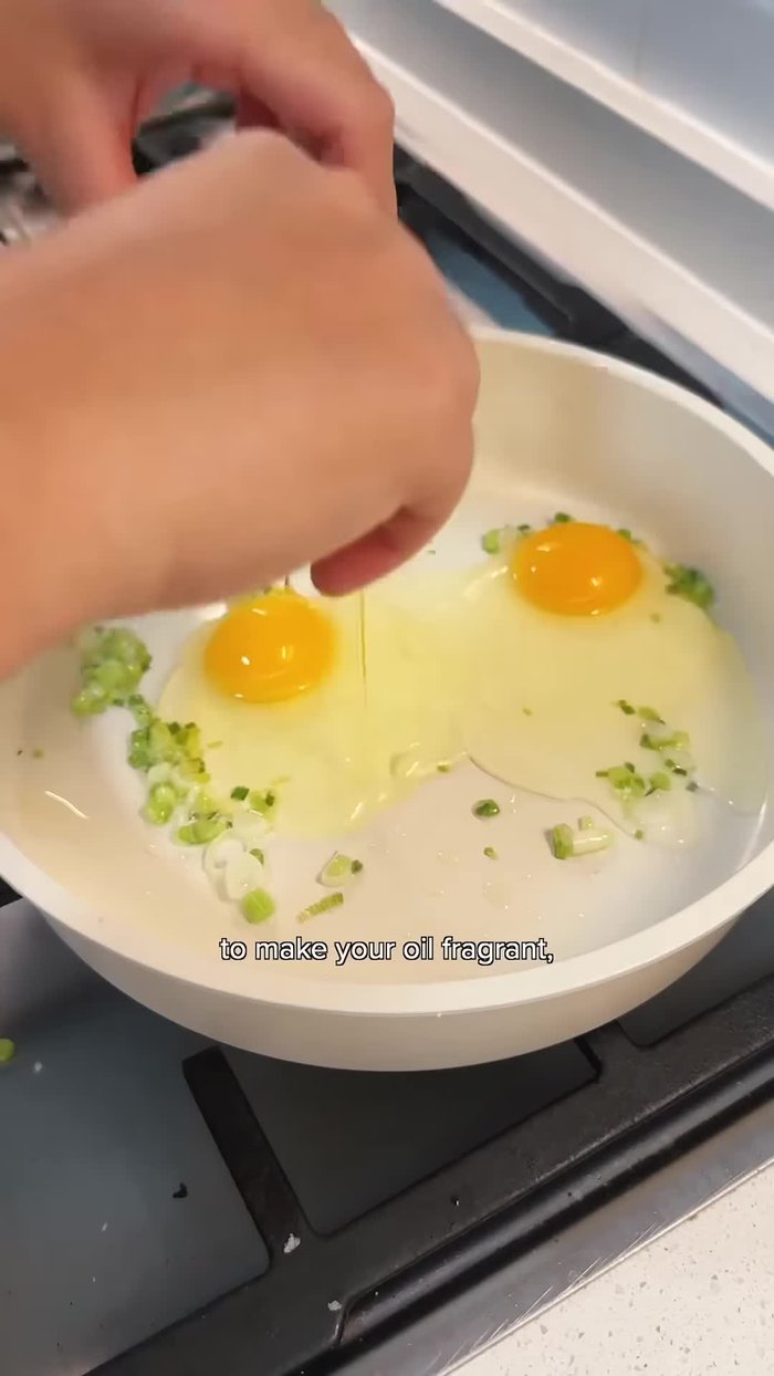 Fry eggs sunny-side up with soy sauce and sesame oil.