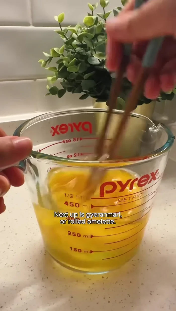 Whisk eggs with salt and minced vegetables.
