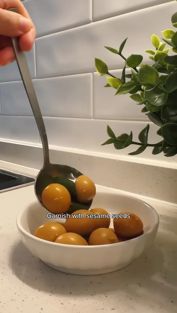 Garnish with sesame seeds and serve with rice.