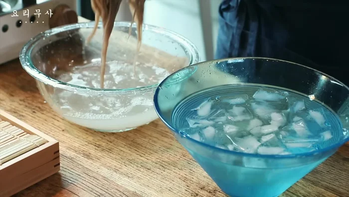 Rinse noodles in cold water, rub vigorously to remove starch, and rinse again in ice water.