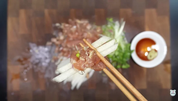 For Yukhoe Bibimbap: Put some sprouts and tuna sashimi on top of the rice.
