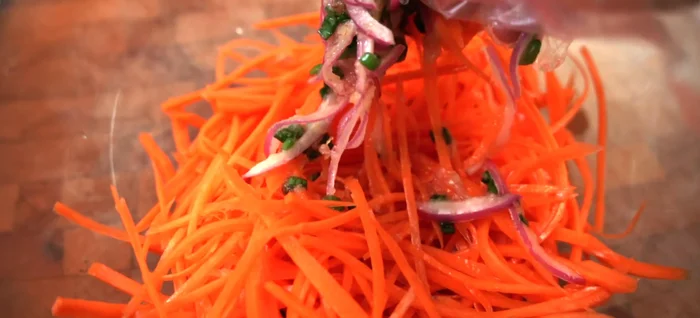 Pour the dressing over the carrots and toss to combine. Add sesame seeds (optional).