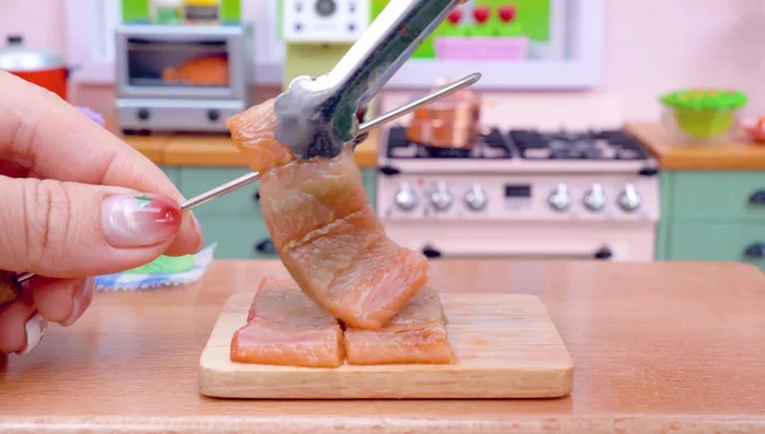 Put the eel pieces on skewers.