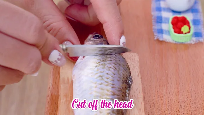 Cut off the fish head.