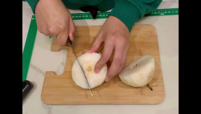 Peel, core, and chop the pear into smaller pieces.