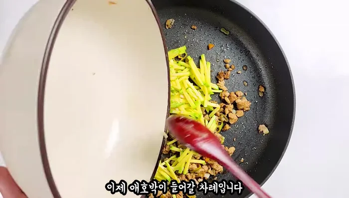 Add the marinated zucchini to the pan. Add more oil if needed and stir-fry until softened.